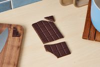 An unwrapped Equal Exchange Extreme Dark chocolate bar.