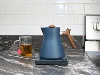 fellow corvo kettle on a countertop with a cup of tea