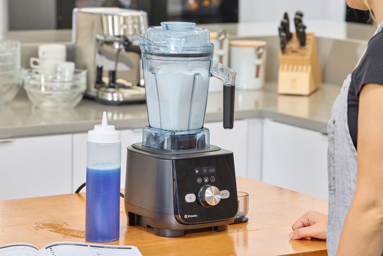 The Vitamix Ascent X5 blender going through the cleaning preset on a kitchen counter