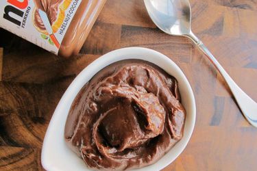 Overhead view of Nutella Chocolate Pudding, served in a small white bowl.