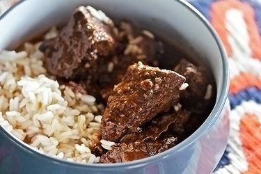 Bowl of drunken pork stew in red wine with rice
