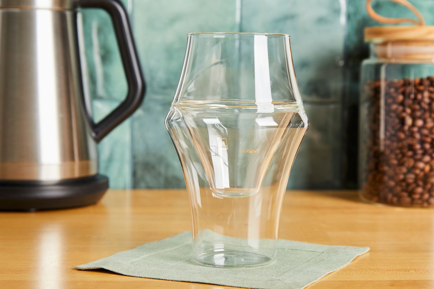 A Kruve coffee cup on a kitchen countertop.