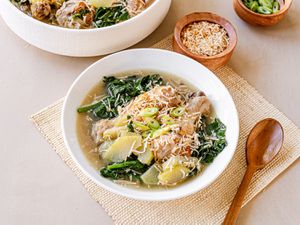 Chicken binakol served in white bowls.