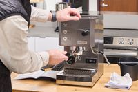 A person makes espresso in the Profitec GO Single Boiler Espresso Machine