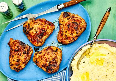 A plate of air-fryer chicken thighs and a side of mashed potatoes