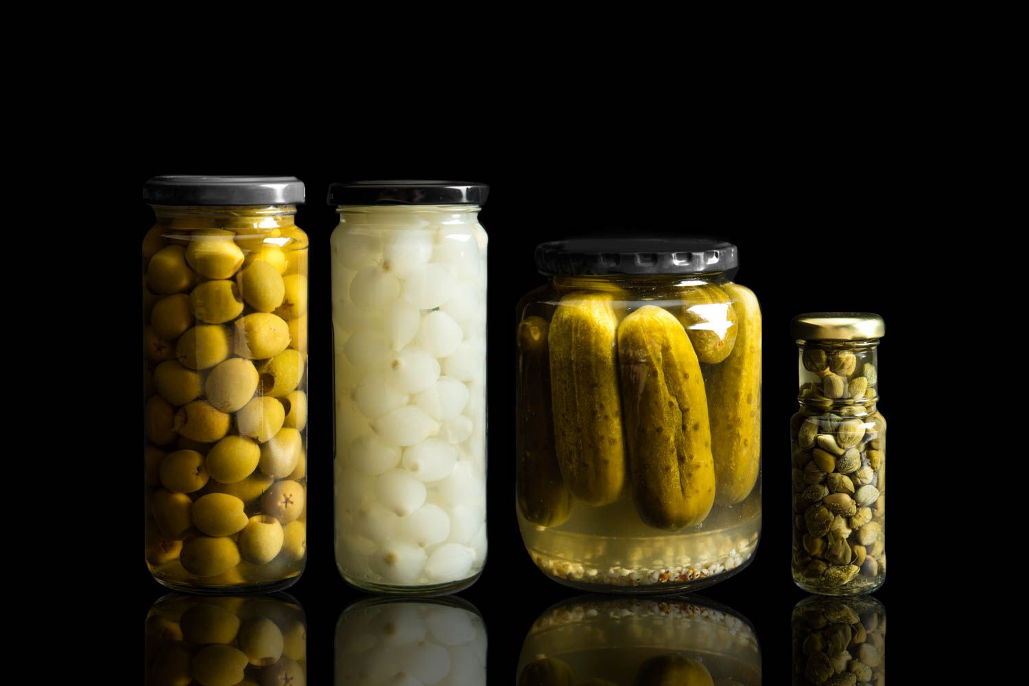 All of the salty brines you can use in a dirty martini: olives, cocktail onions, pickles, and capers. 