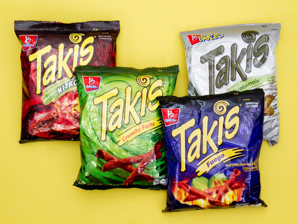 An assortment of packages of takis. 