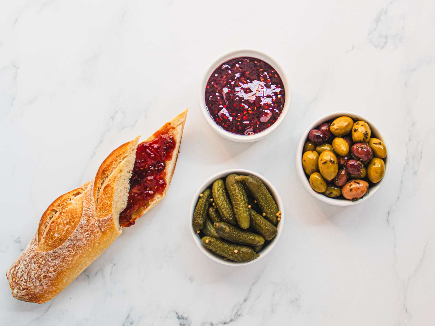Overhead view of jellies and pickles and olives 