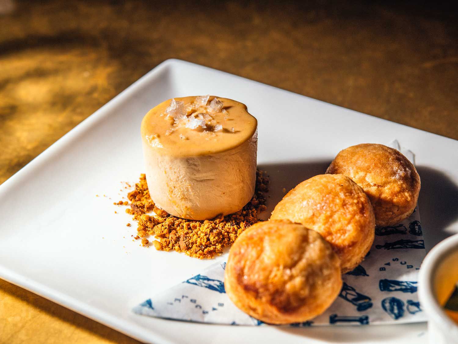 An appetizer of foie gras and gougères at Justine