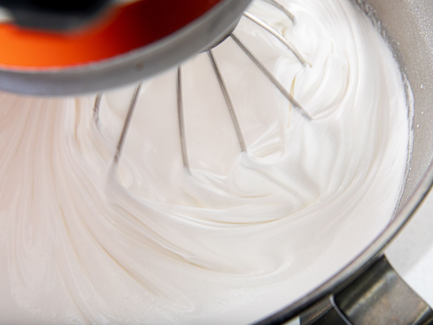 Meringue being mixed in a stand mixer