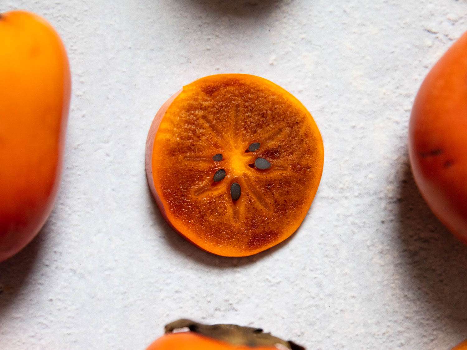 Close-up of a cross-section slice of a tsurunoko persimmon