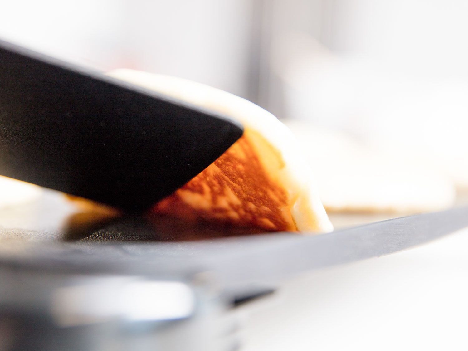 testing a pancake for doneness 