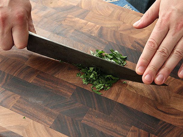 A knife midway through completing a rock chop.