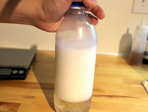 A bottle mostly filled with foam, showing how important it is to leave ample room for foam.
