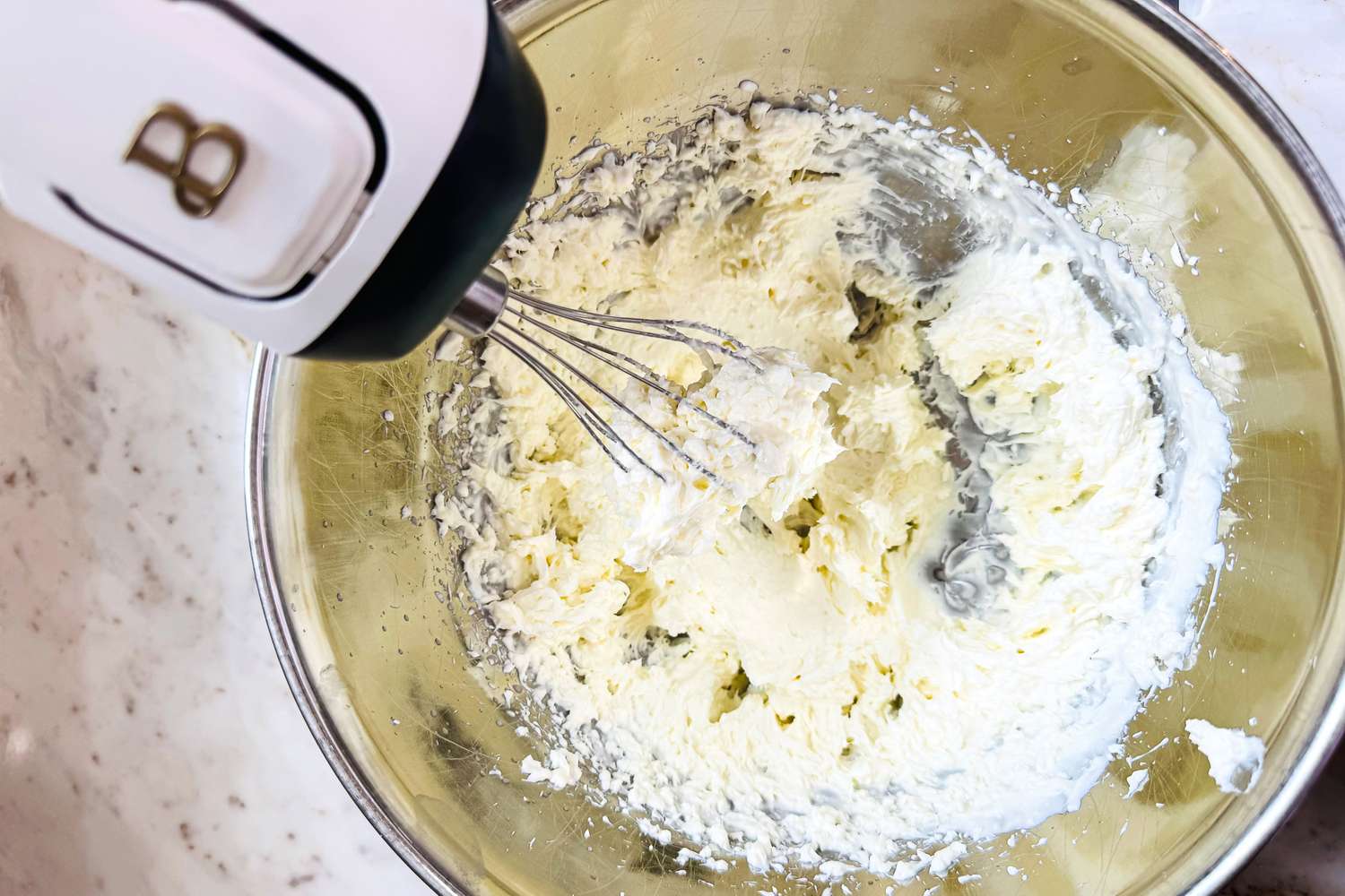 Beautiful 6-Speed Electric Hand Mixer mixing food in a bowl