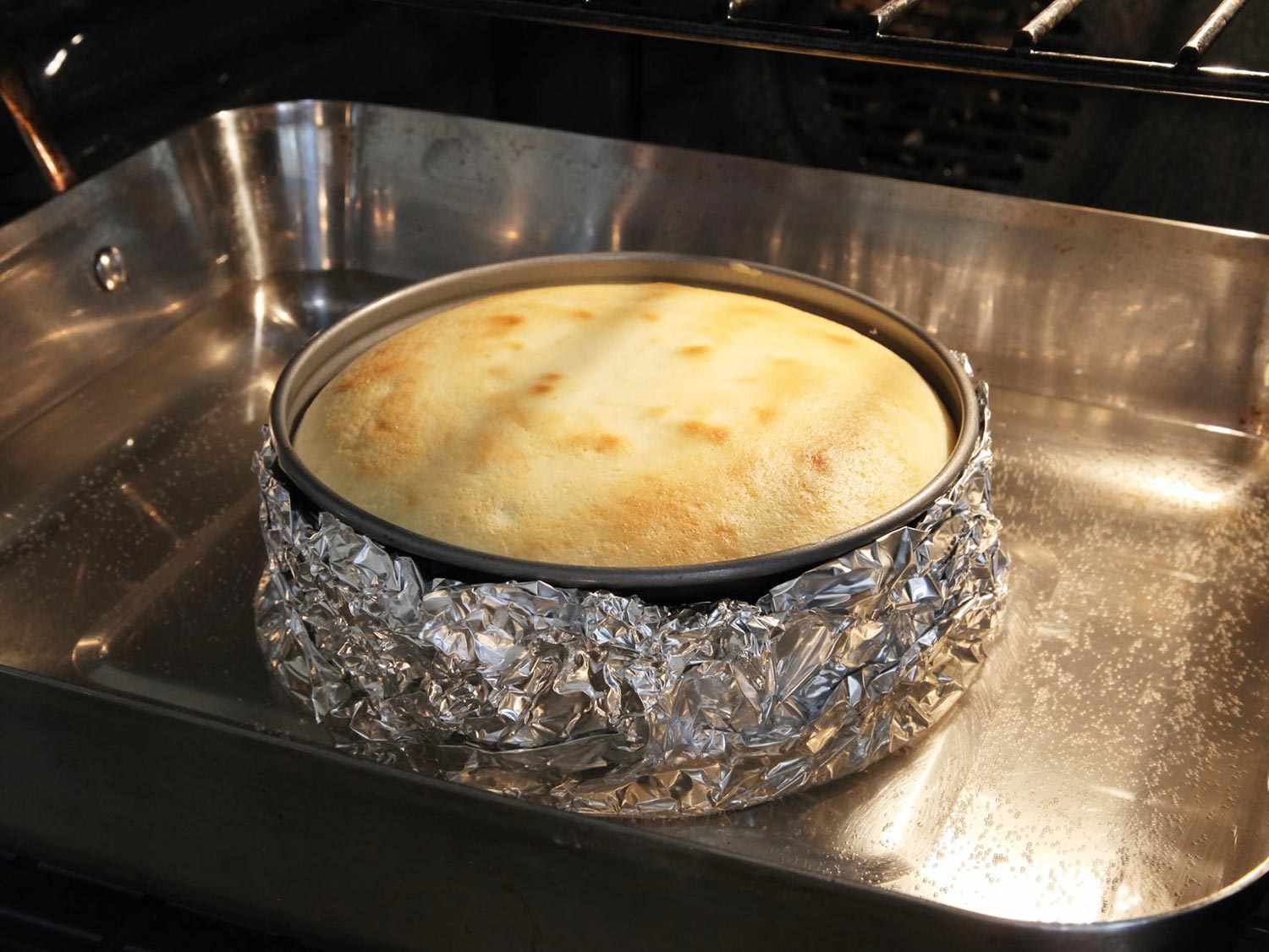 The cheesecake in the oven, done and ready to remove.