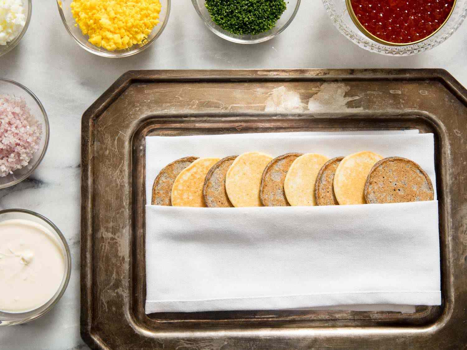 Caviar service with mixed blini and salmon roe