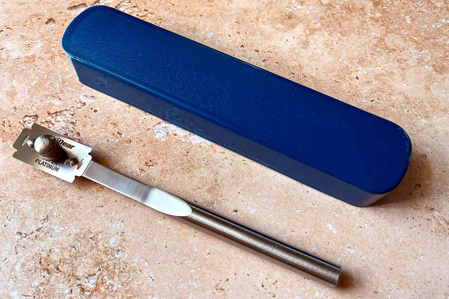 The Baker of Seville bread lame next to a blue storage case