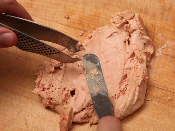 Author smoothing out the liver with an offset spatula, looking for more veins.