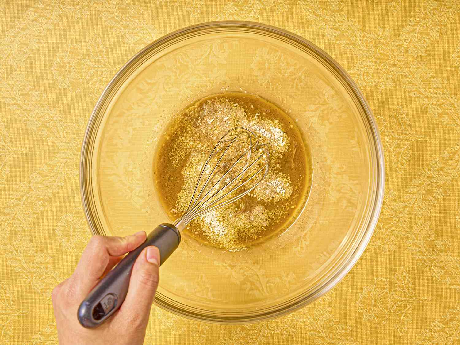 Overhead of whisking seasoning together 