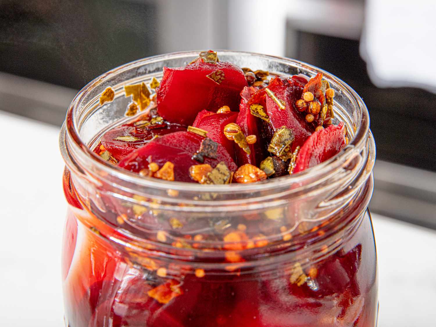 Close up of beets and spices in jar