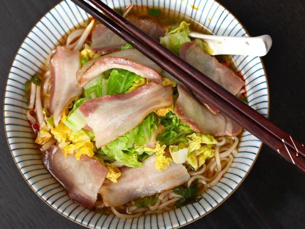 A bowl of bacon and cabbage ramen.