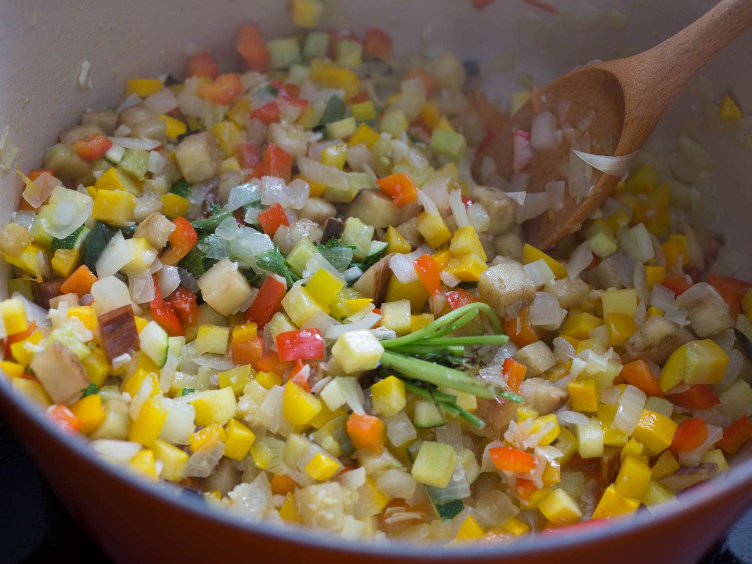 All of the ingredients for ratatouille, gently cooking in a Dutch oven.