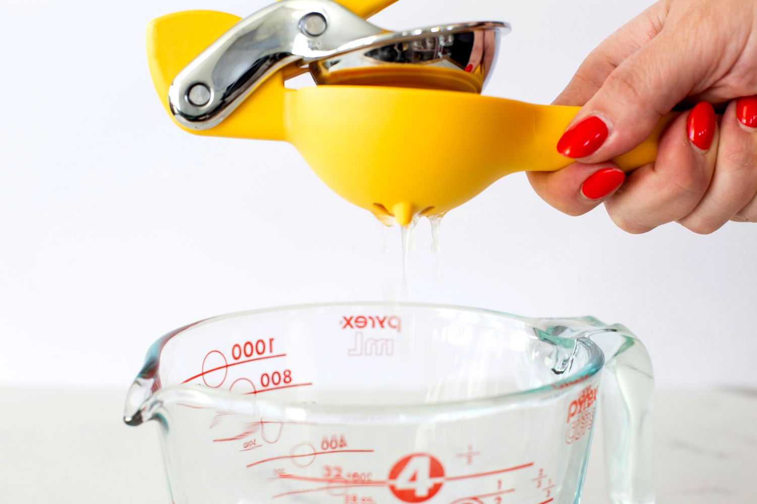 A person juicing a lemon with the Chef'n citrus juicer.