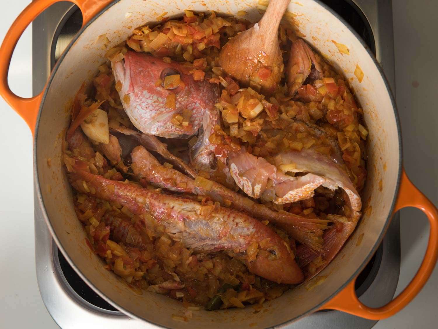 Fish in the pot for making the soup base in bouillabaisse.