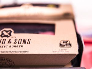 Closeup of a package of meat with a "Certified Angus Beef" badge printed on it.