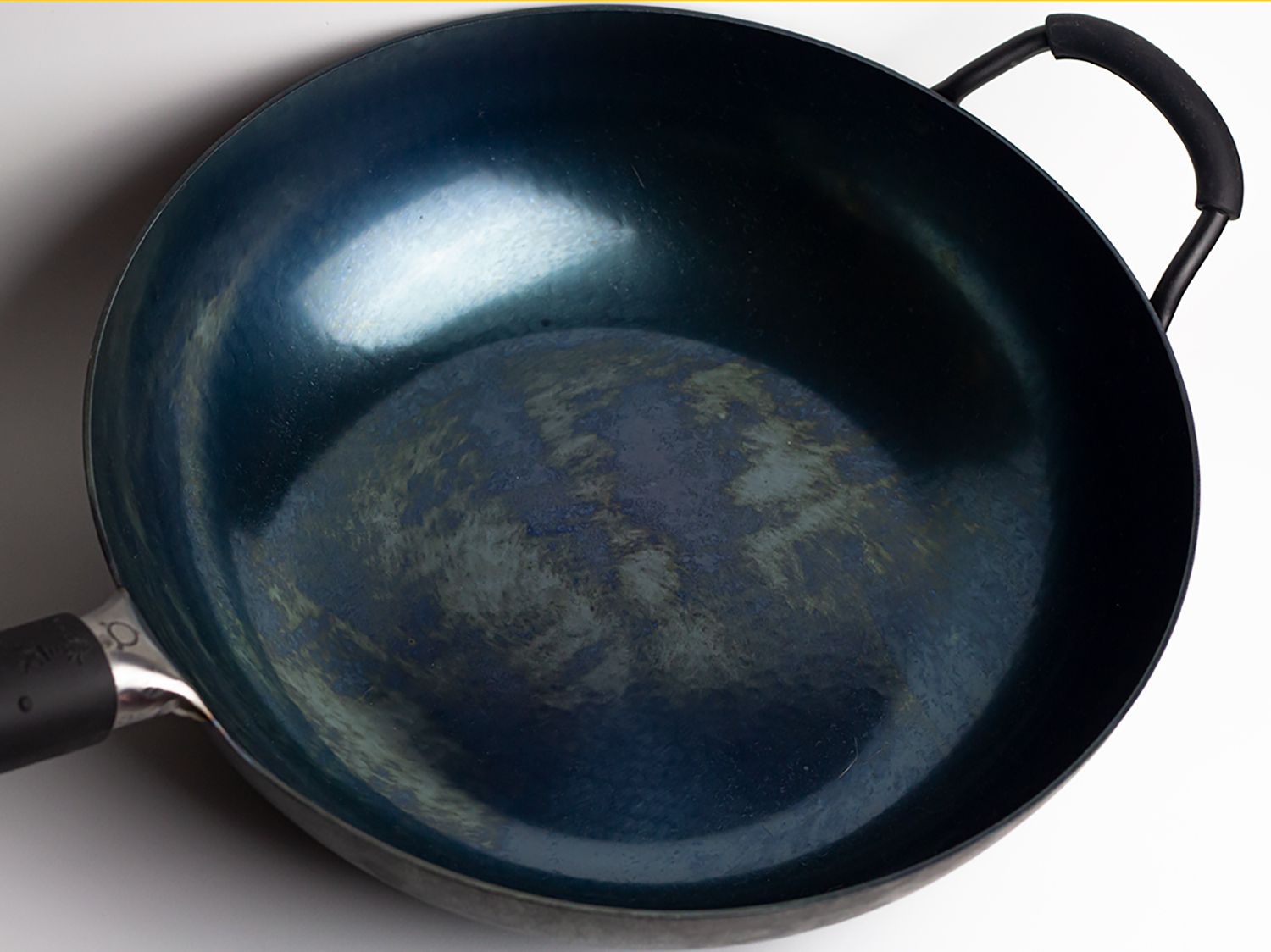 Zhen San Huan wok on white surface