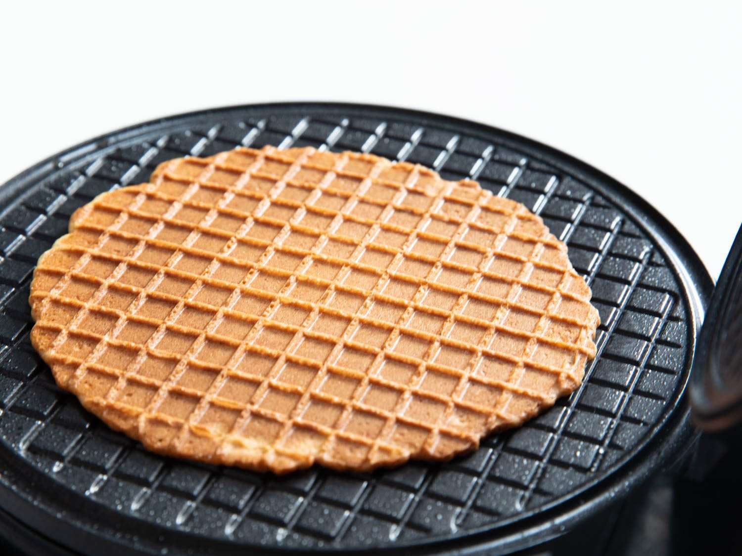 Finished waffle cone still on the iron.