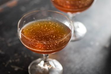 Two Madeira cocktails in glass coupes