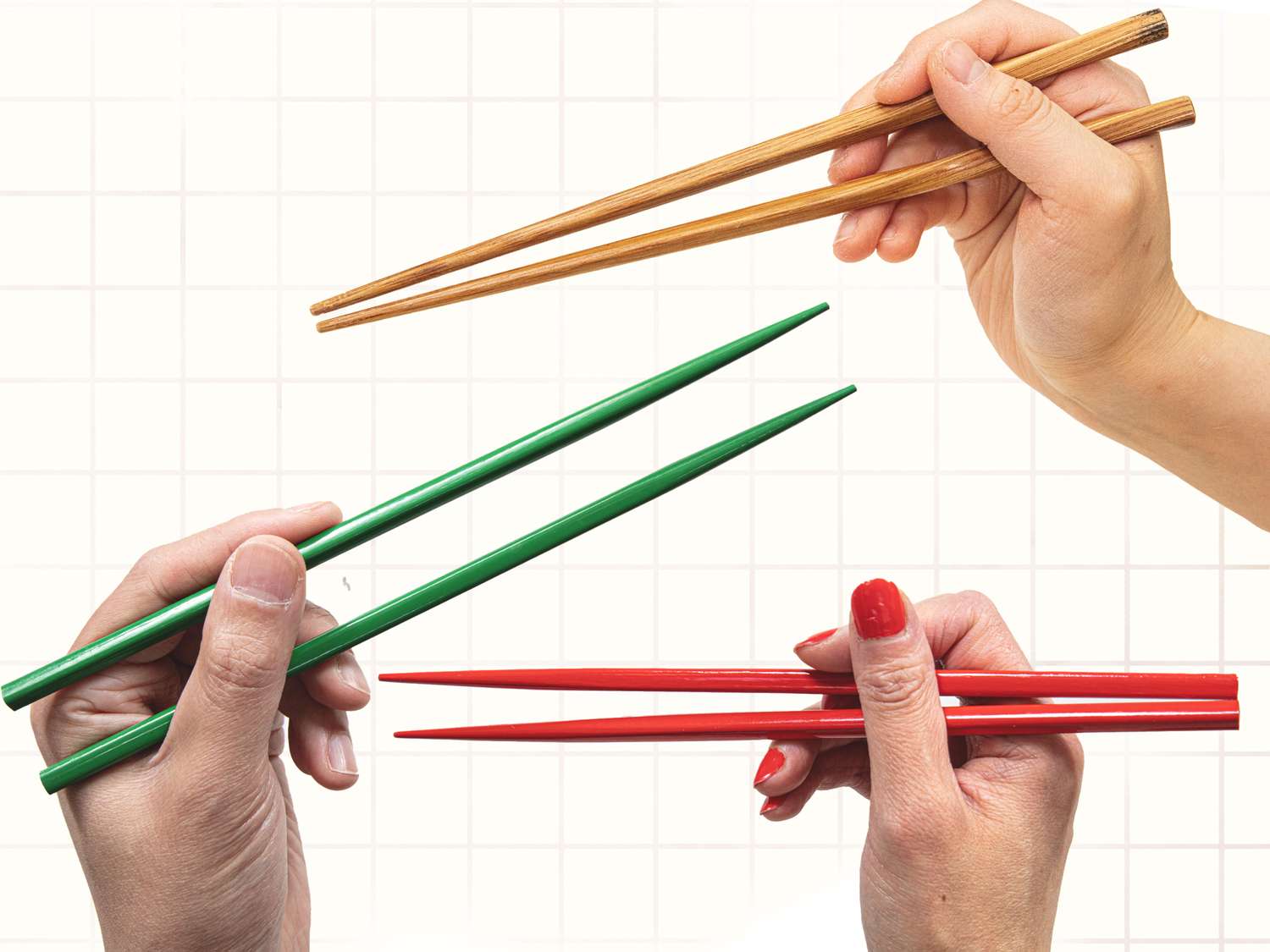 Four hands holding chopsticks in different positions