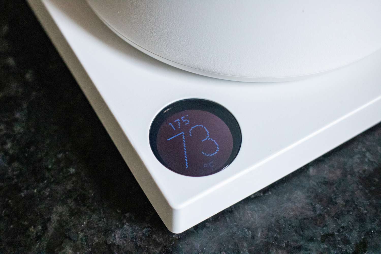 The digital display showing the temperature of an electric kettle