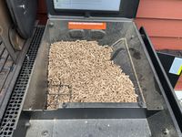 The wood pellet hopper of the Traeger Woodridge grill