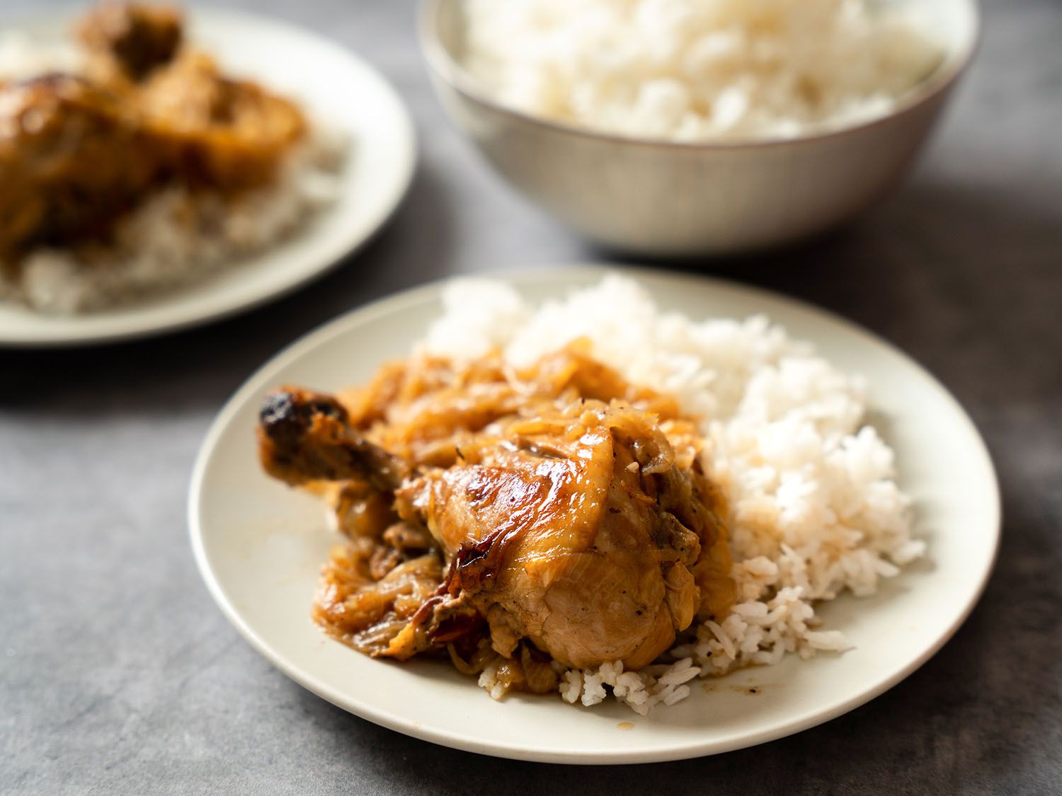 Chicken yassa on a bed of white rice.