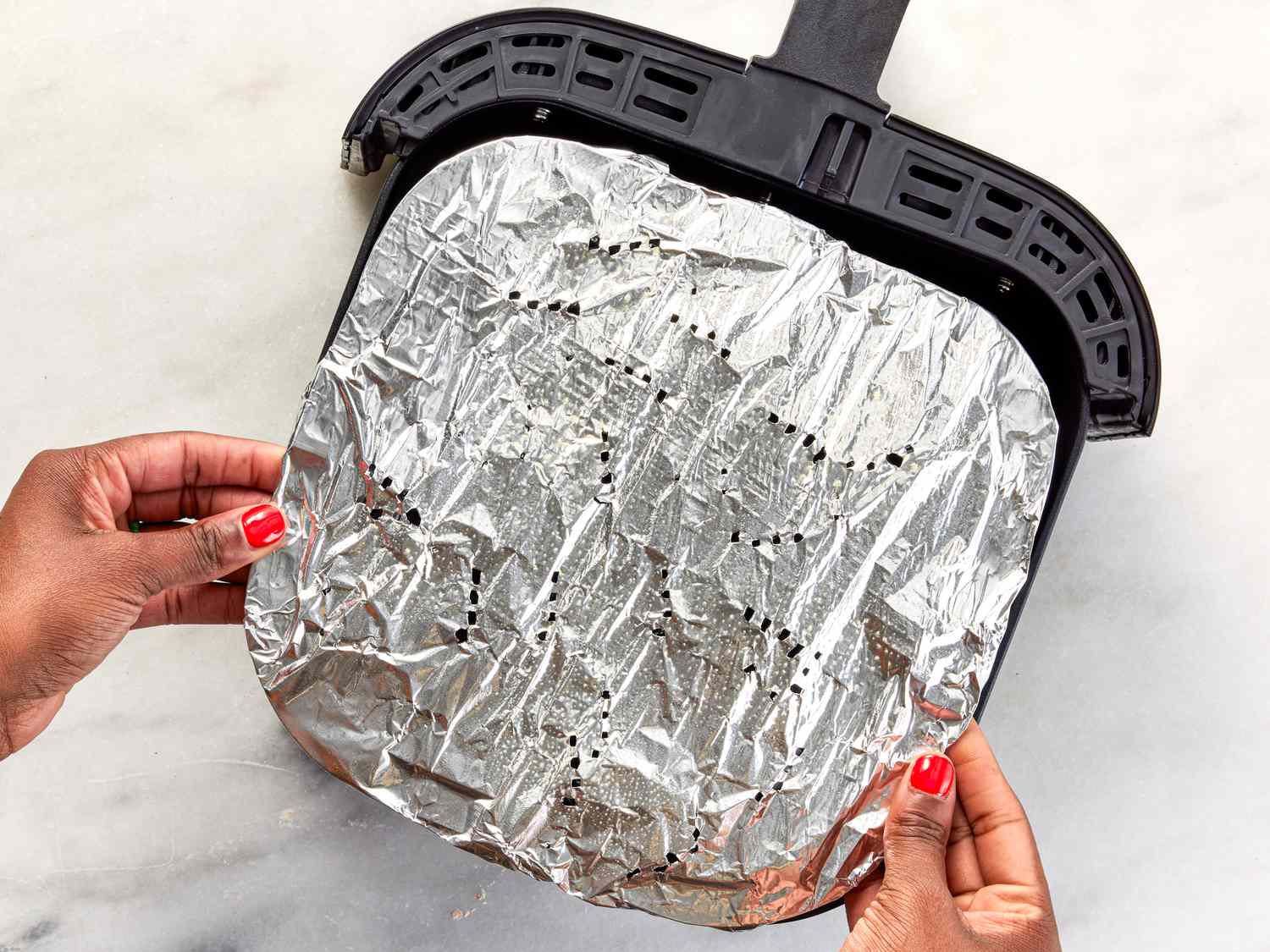Wrapping air fryer basket in aluminum foil
