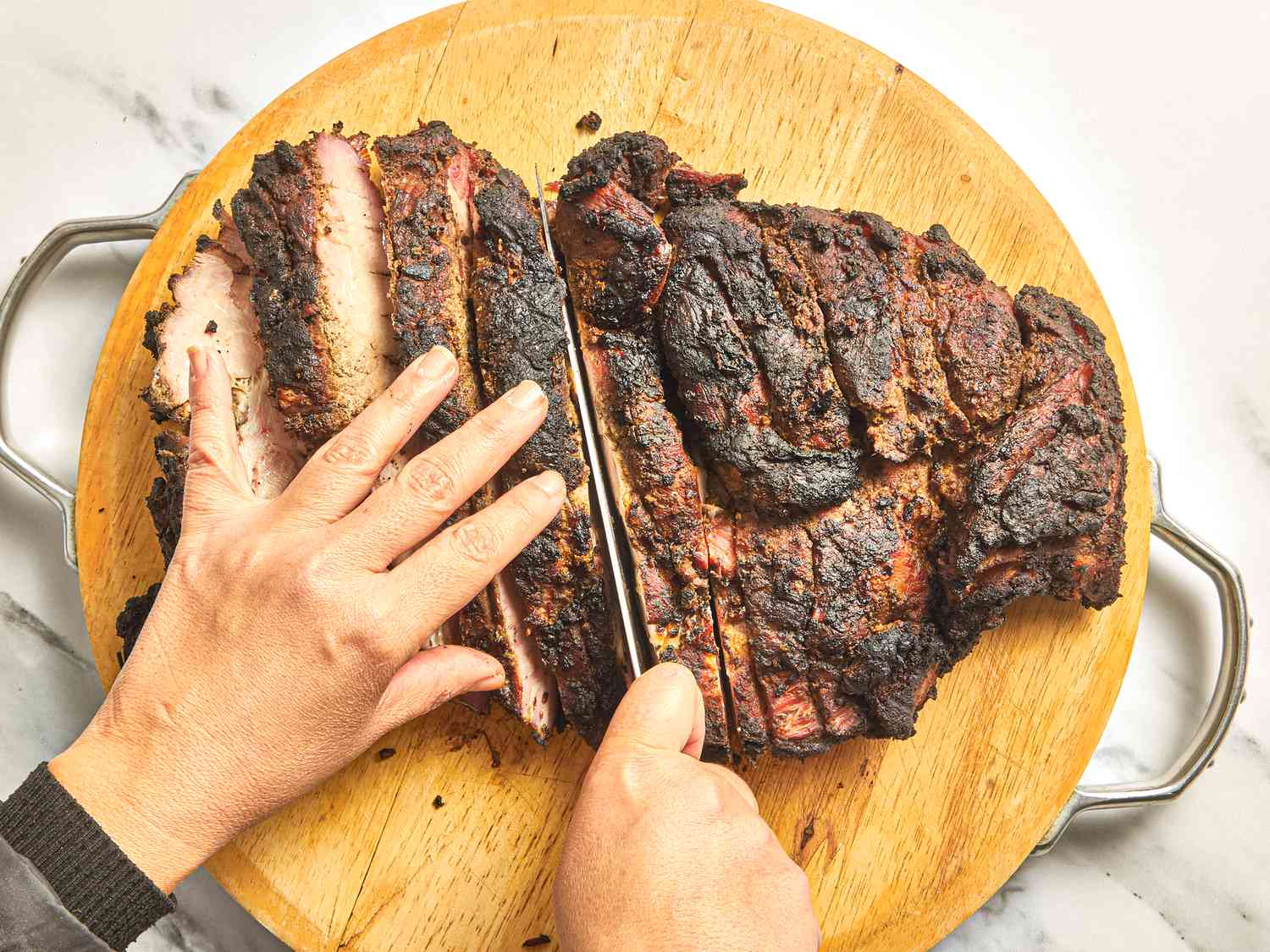 Overhead view of cutting jerk pork