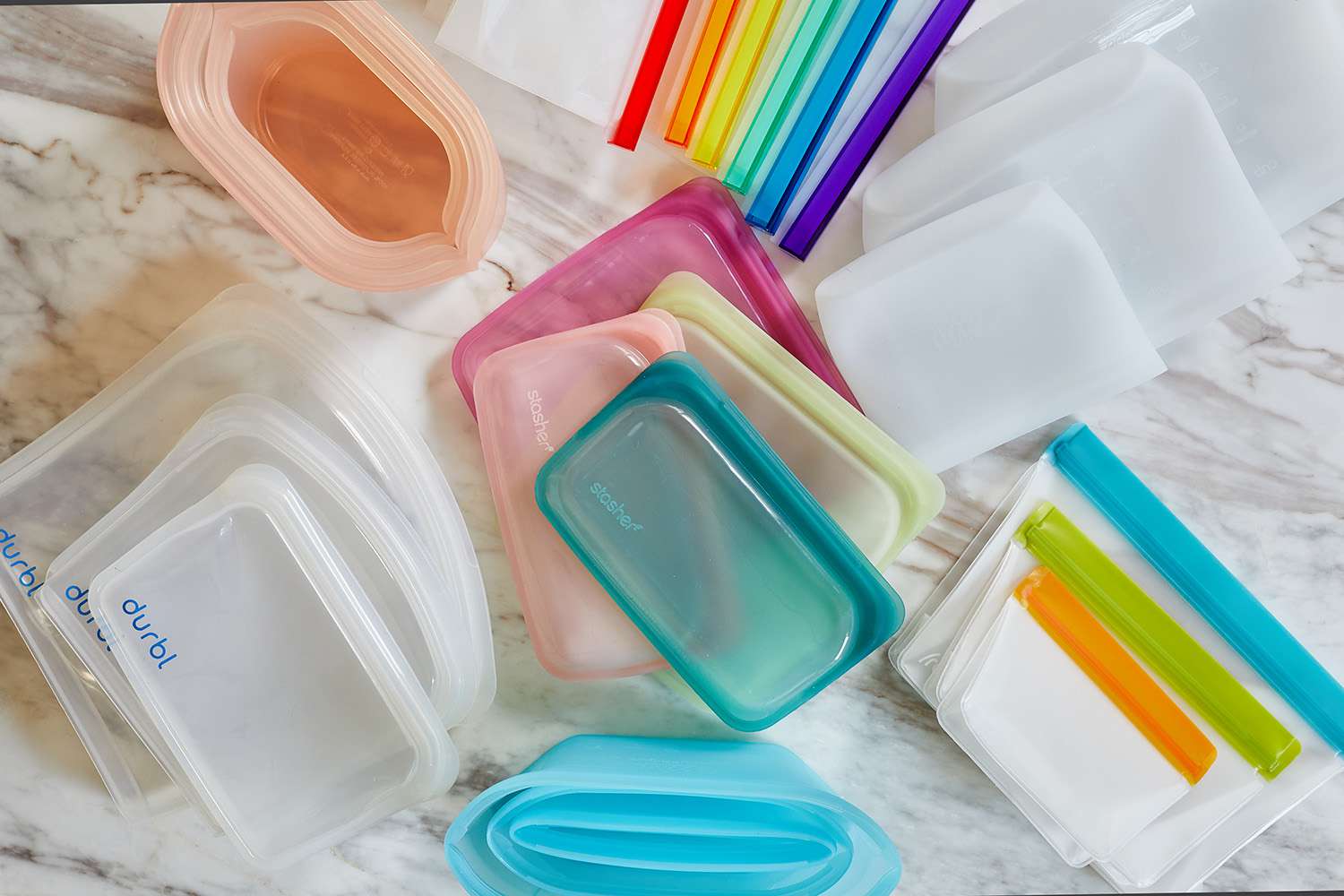A group of reusable storage bags on a marble surface
