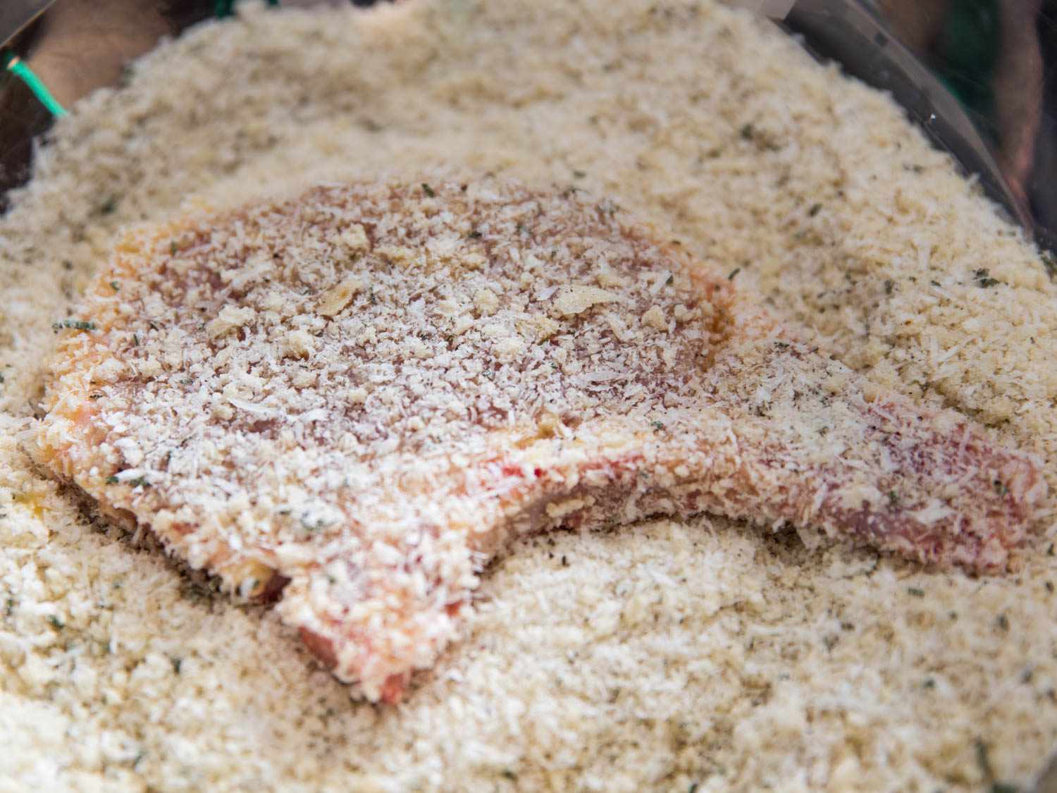 A pork chop in bread crumbs.