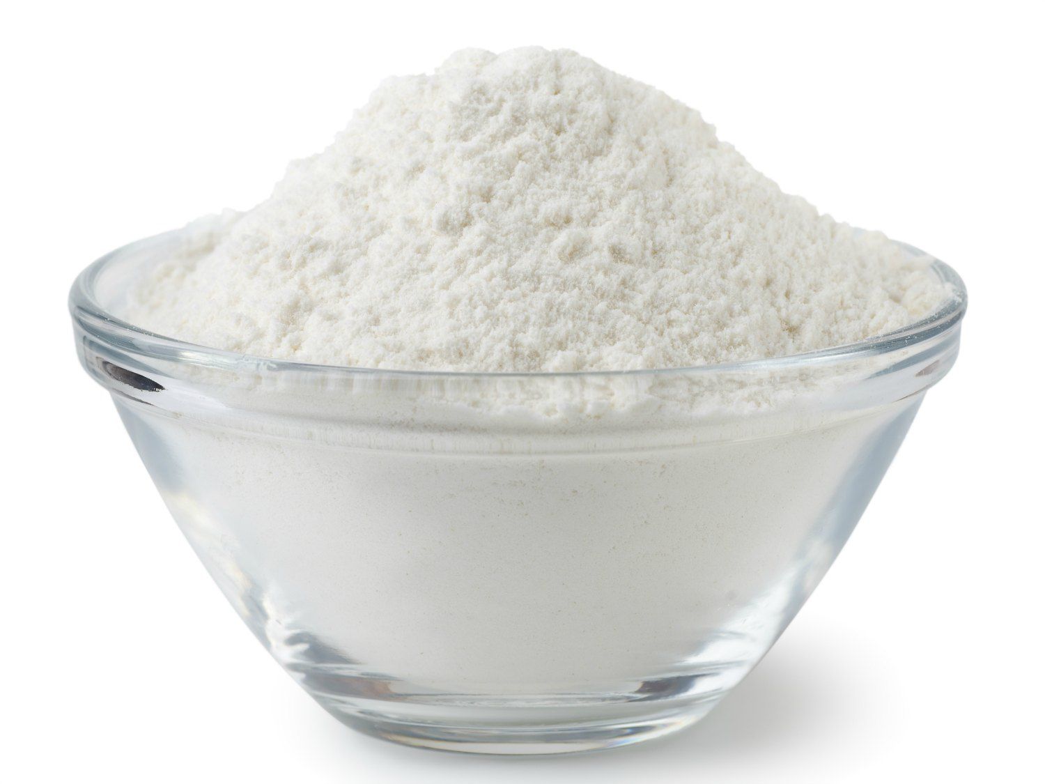Close-up of flour in a glass bowl.