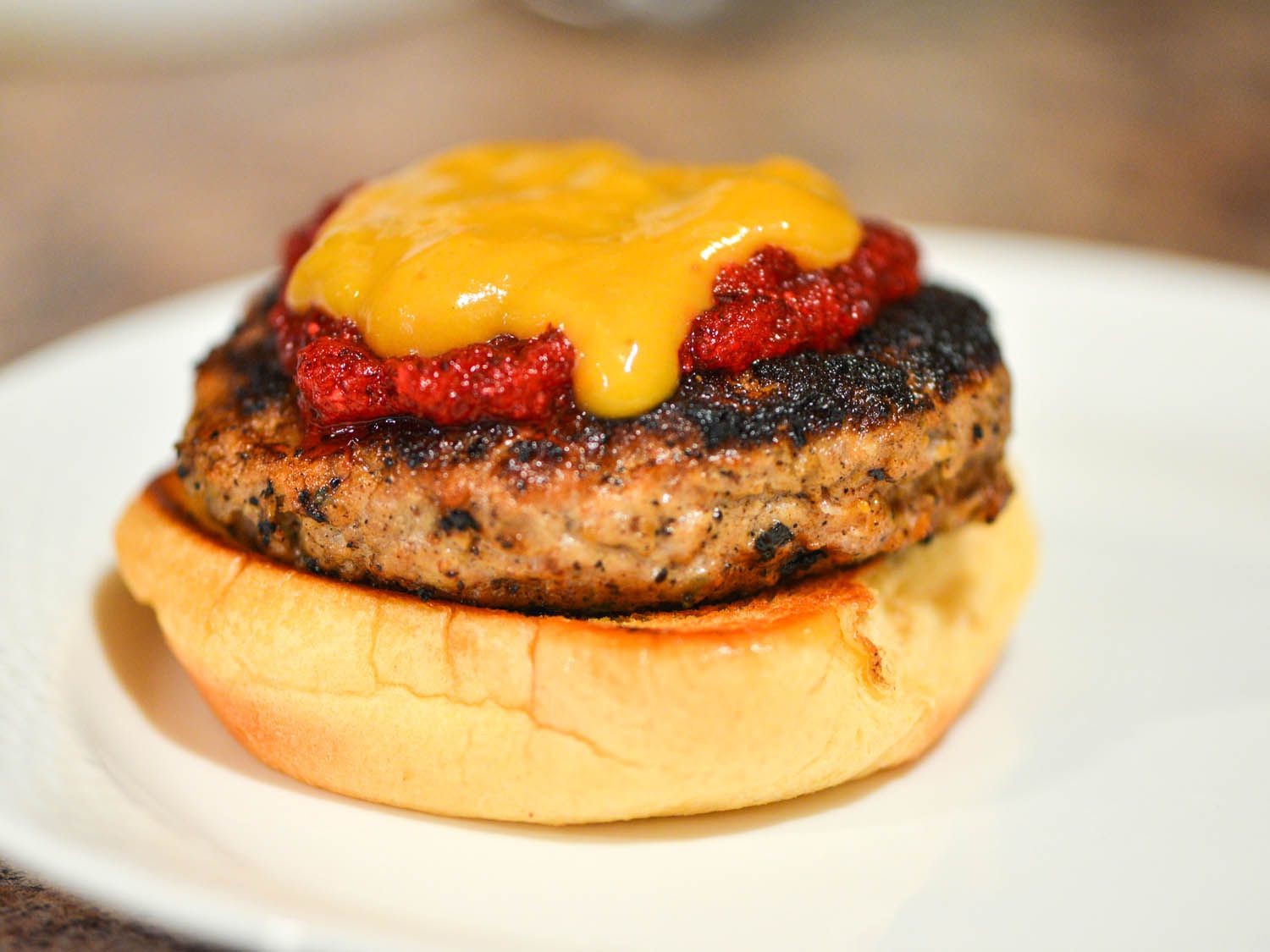 Gravy layered over cranberry-apple relish and turkey burger.