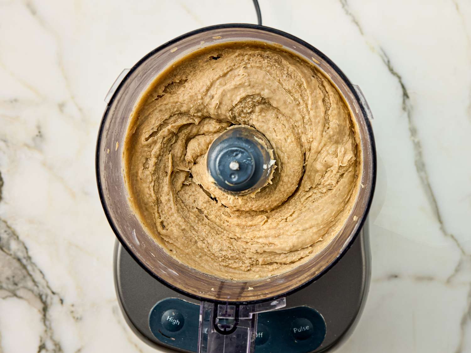 Food processor containing blended banana butter