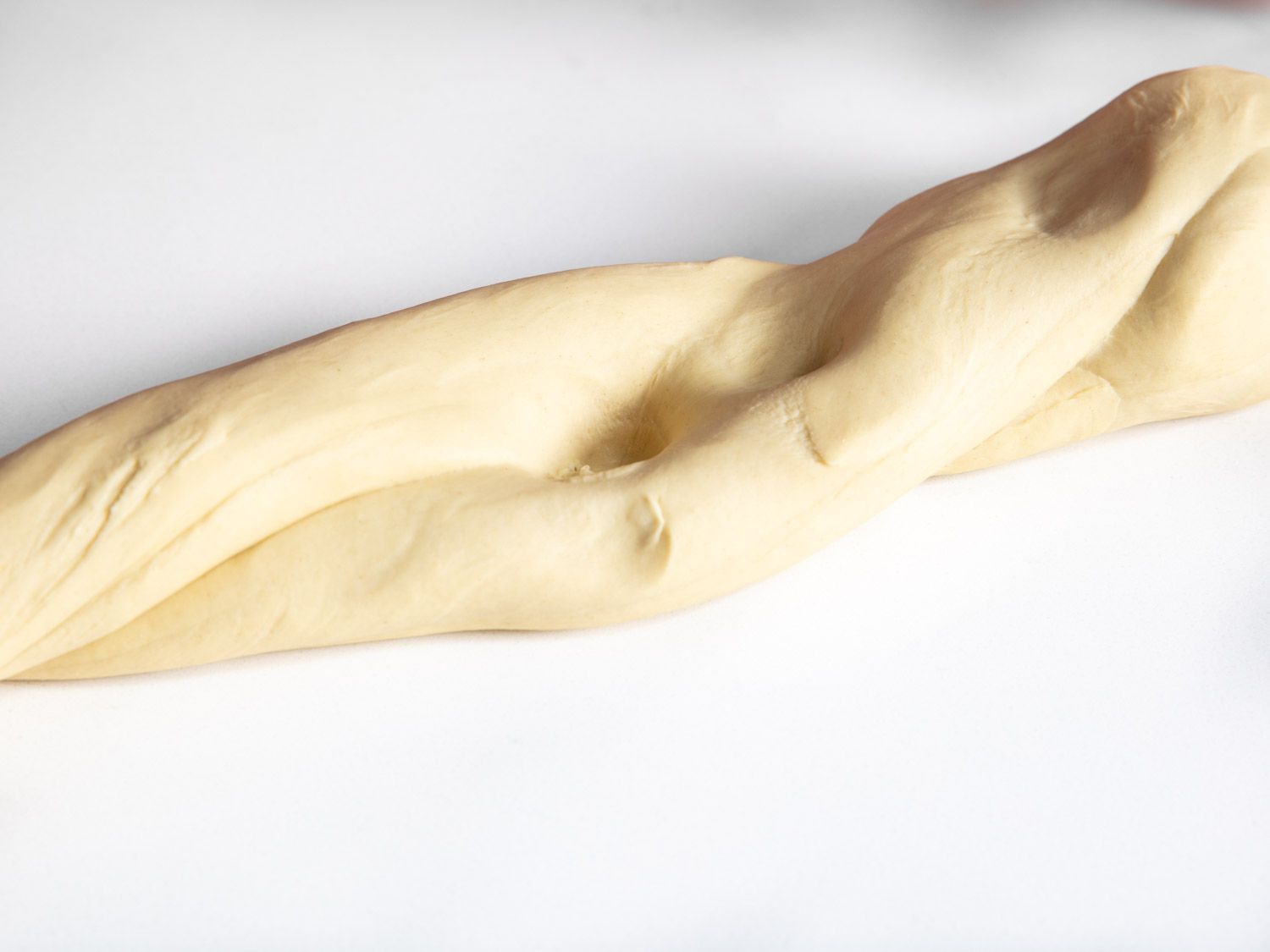 Indents in noodle dough made to check elasticity.