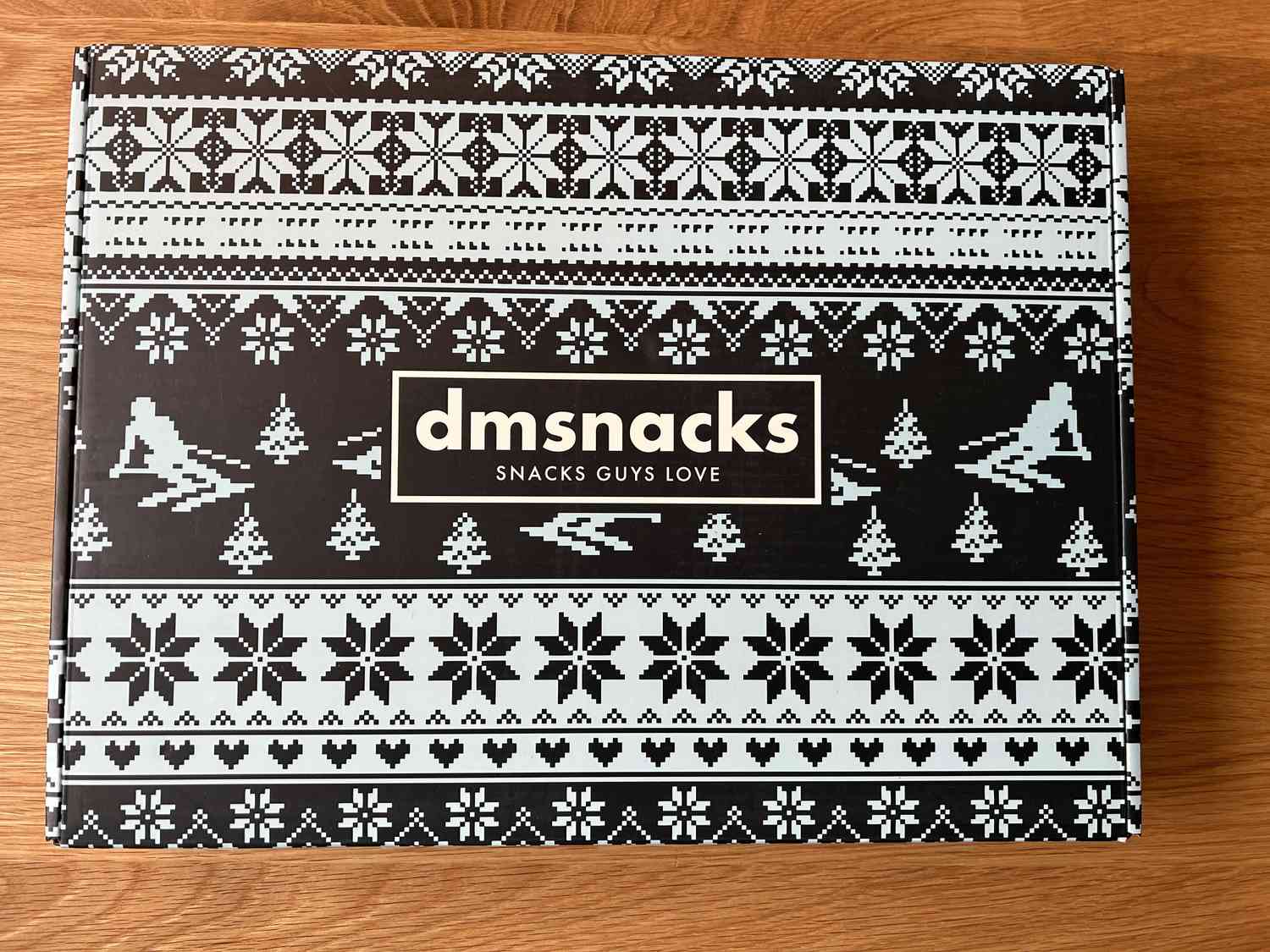 A box with the slogan "Snacks Guys Love"