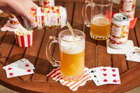 pouring a can of non alcoholic juicy ipa into a glass