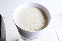 nut milk straining through the chefn