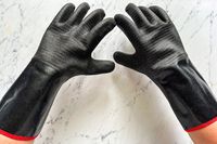 A person wears the Grill Armor Gloves BBQ Waterproof Gloves