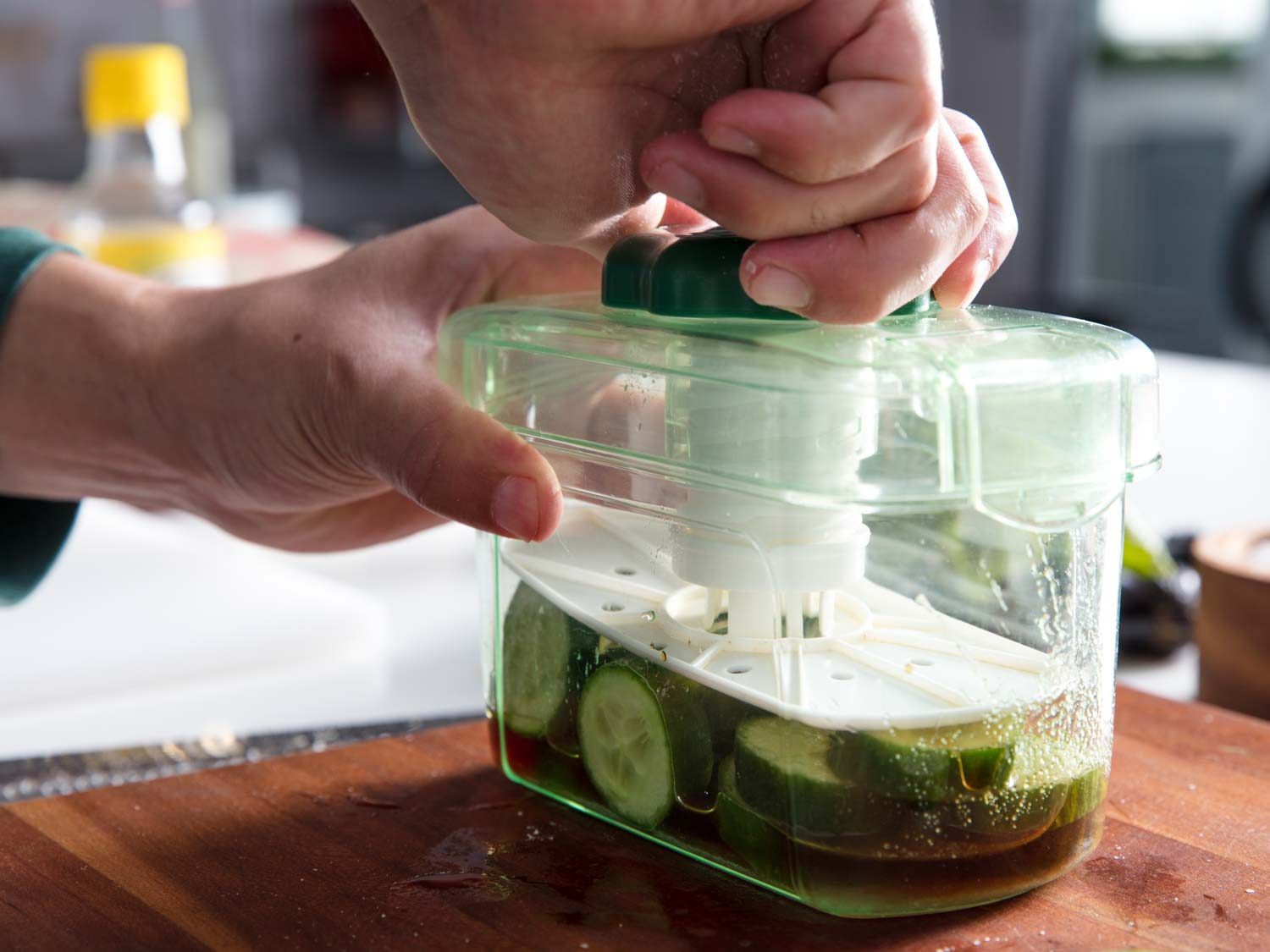 Quick cucumber pickles in a pickle press